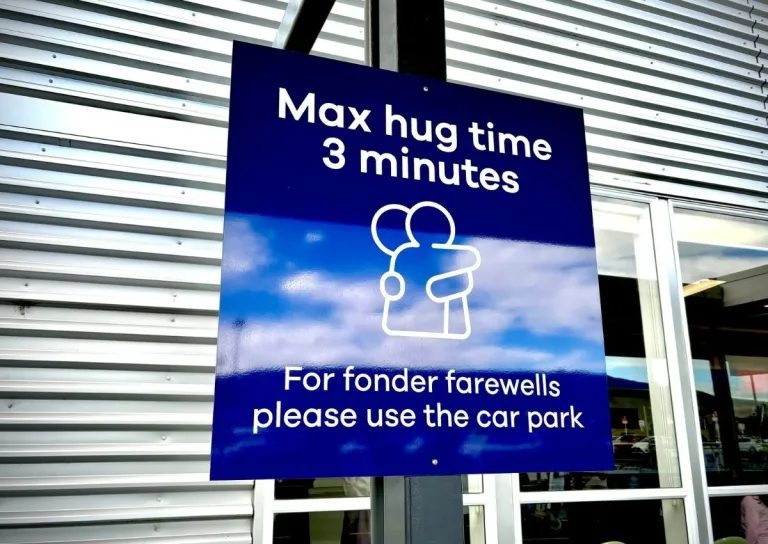 Dunedin Airport 3 minute hug rule