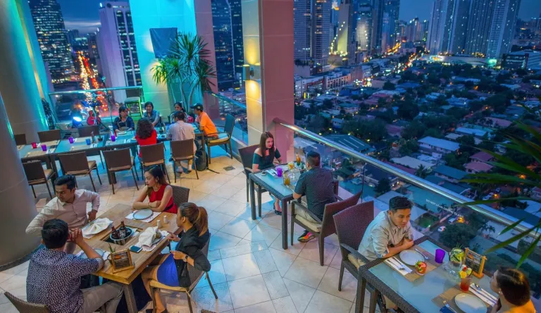 romantic couples and customers on a date at the Encima Roofdeck Restaurant in City Garden Hotel Makati