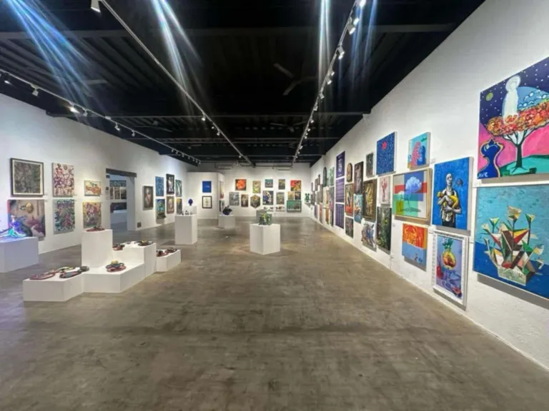 a lounge area with all the painting displays at the Pinto Art Museum