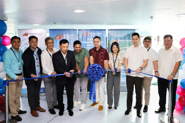 people cutting ribbon for the launching of PAL flights to Isabela