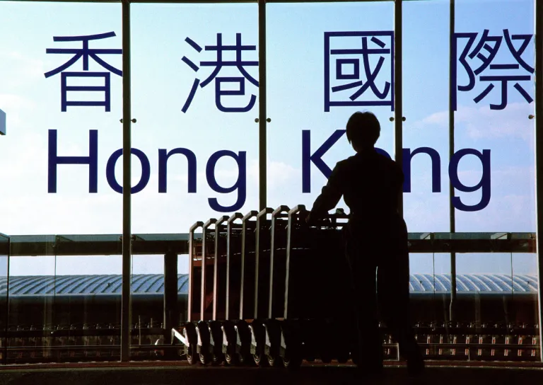 person with carts hong kong airport