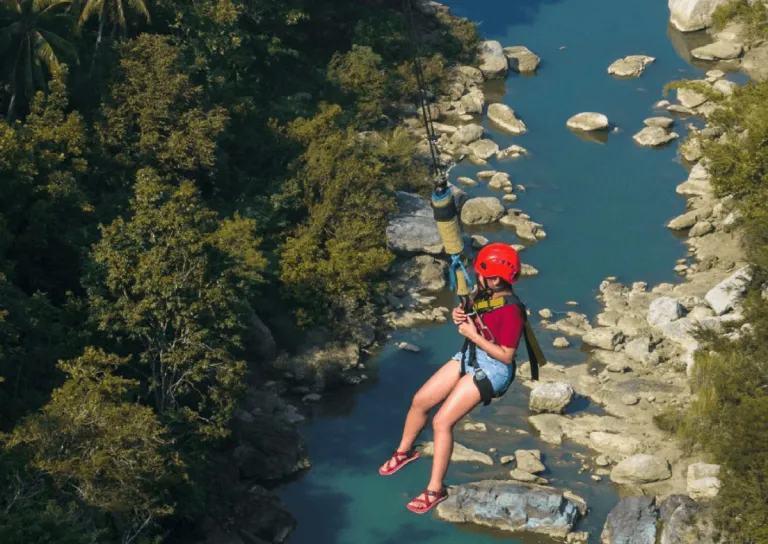 woman on a zipline in danao adventure park in bohol