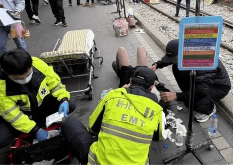 filipino woman getting medical attention from taiwanese