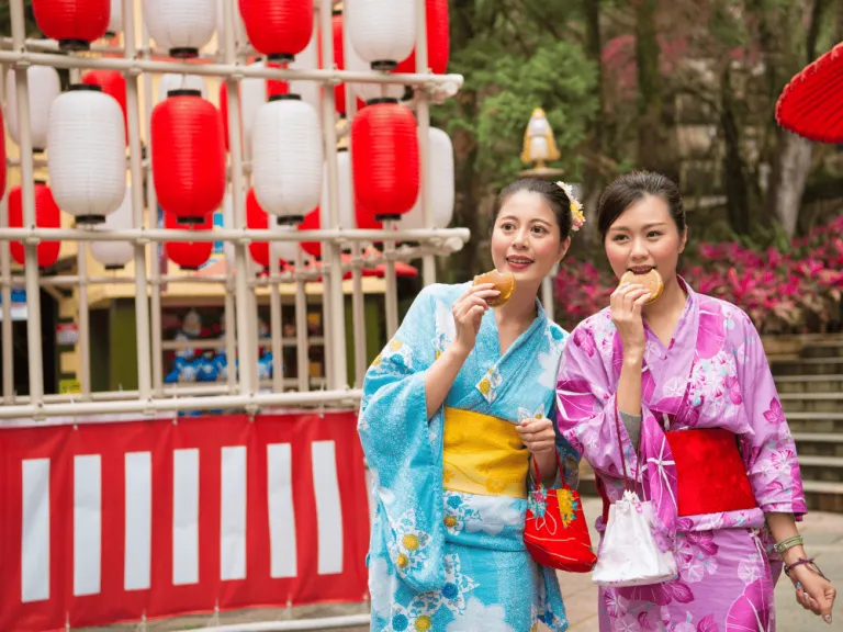 two asian women in attractions in japan