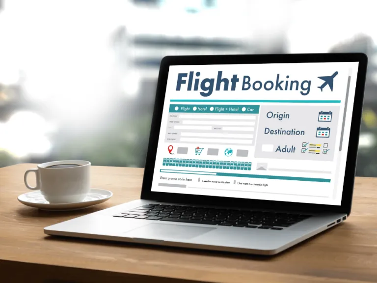 laptop with image of booking a flight