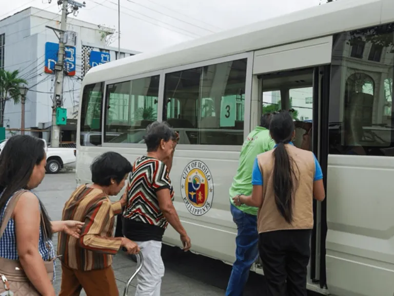 seniors getting on the bus for a free tour in iloilo