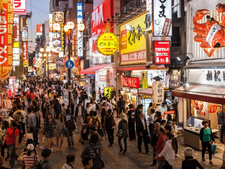 people on the streets of dotonbori in Japan