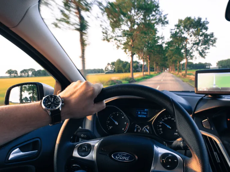 man driving a car