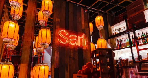 image for article Drink, Dine, Dance at This Stylish Cocktail Bar Hidden Behind a Sari-Sari Store Fridge